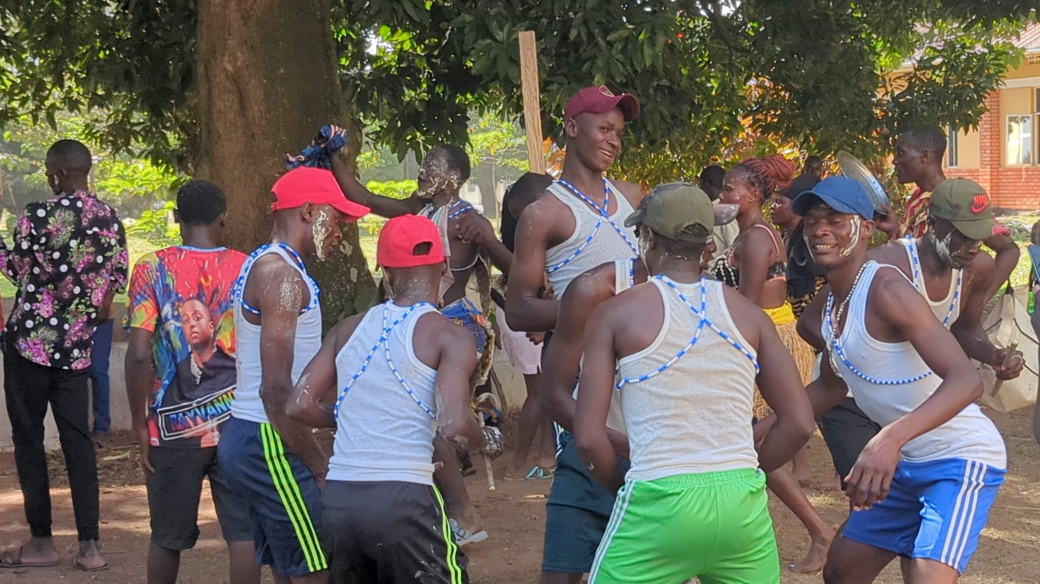 Young men preparing for Imbalu ceremony