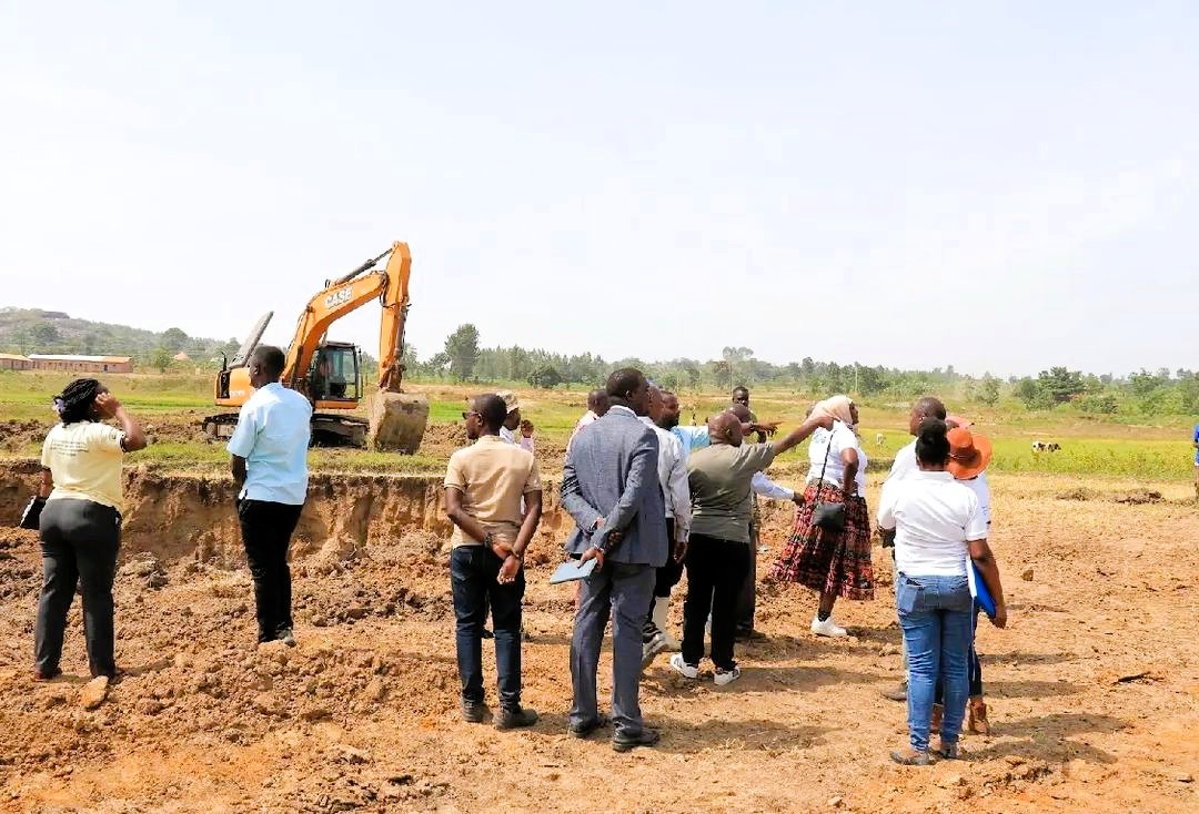 Government officials and community at excavation site